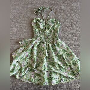 Green floral mini dress with ruffle detailing and halter neck